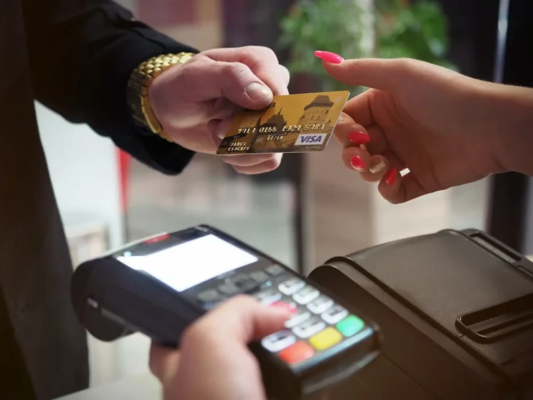 person paying with a credit card in-store